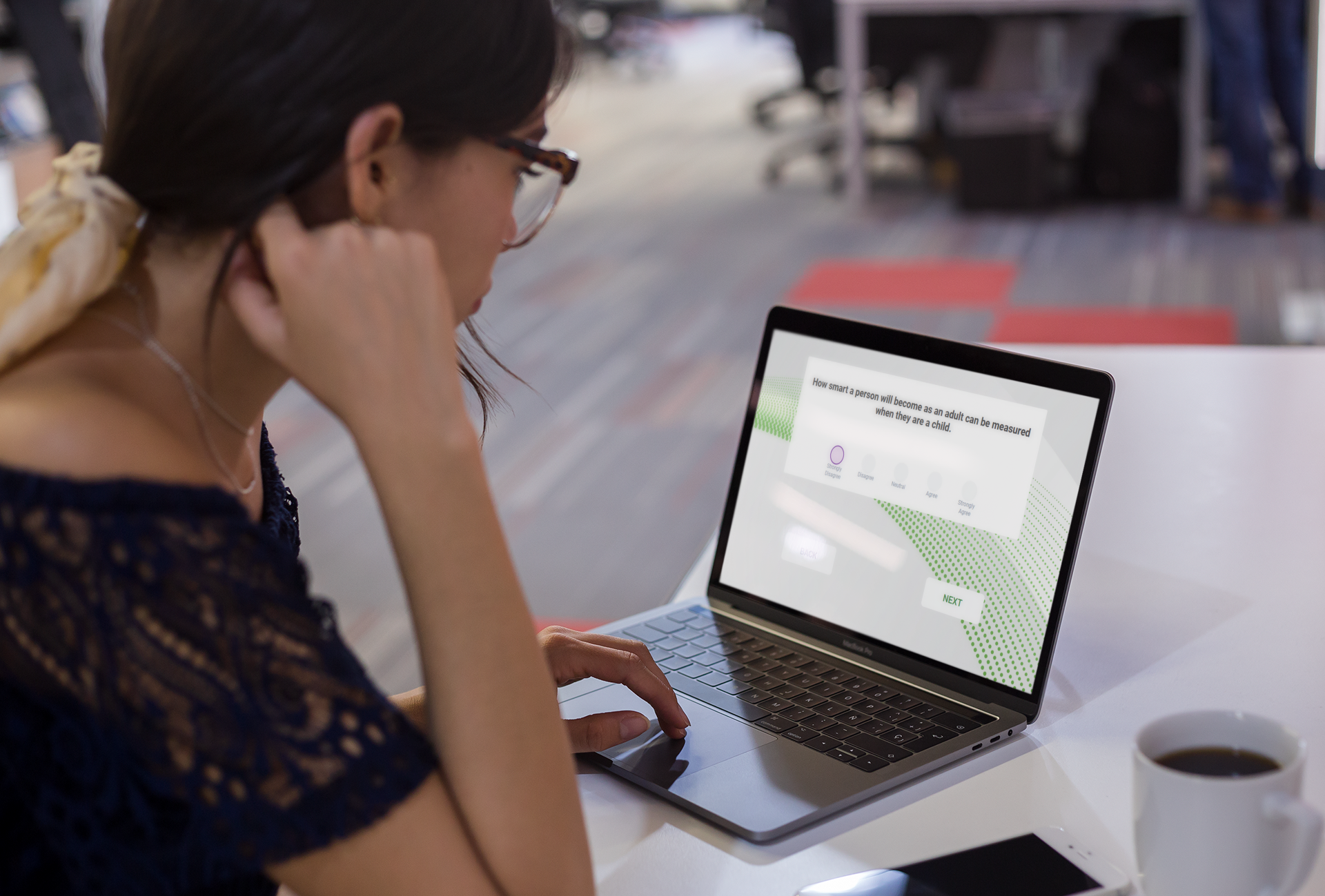 Woman taking assessment on laptop